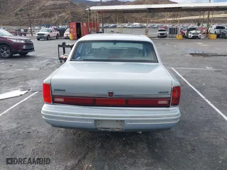 1993 Lincoln Town Car Executive with VIN 1LNLM81W6PY618899, listed as a IAAI auction lot 41566437 with 158,821 mi miles. Bid and sale history available at carsss.com. Image 16.