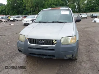2003 Ford Escape XLT Popular z VIN 1FMYU03193KB02834, wystawiony jako IAAI lot #42423365 z przebiegiem 350 065 mil mil oraz . Historia ofert i sprzedaży dostępna na DreamBid. Obrazek 6.