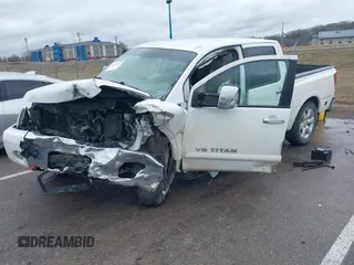 2012 Nissan Titan SL with VIN 1N6AA0EC7CN311109, listed as a IAAI auction lot 41420110 with 209,731 mi miles and . Bid and sale history available at DreamBid. Image 2.