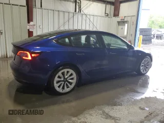 2022 Tesla Model 3 with VIN 5YJ3E1EA7NF369551, listed as a Copart auction lot 55610805 with 128,311 mi miles and Clean Title. Bid and sale history available at DreamBid. Image 3.