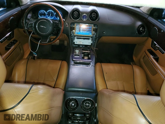 2013 Jaguar XJ with VIN SAJWJ1CD1D8V51462, listed as a Copart auction lot 50527985 with 62,995 mi miles and Salvage title. Bid and sale history available at DreamBid. Image 8.