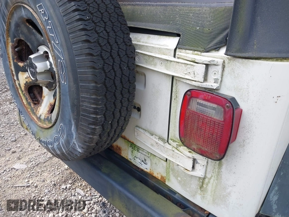 1998 Jeep Wrangler SE with VIN 1J4FY29P0WP792787, listed as a IAAI auction lot 42631661 with 190,180 mi miles and . Bid and sale history available at DreamBid. Image 14.