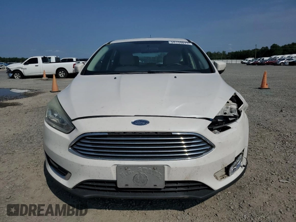 2015 Ford Focus Titanium с VIN 1FADP3N24FL214429, выставлен на аукционе Copart как лот 59159075 с пробегом 157 353 миль миль и Списание • Salvage title. История ставок и продаж доступна на DreamBid. Изображение 5.