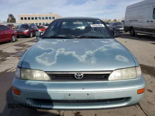 1994 Toyota Corolla Deluxe with VIN JT2AE09B4R0067104, listed as a Copart auction lot 83565064 with 207,923 mi miles and Salvage title. Bid and sale history available at DreamBid. Image 5.