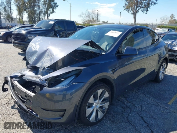 2022 Tesla Model Y Long Range with VIN 7SAYGAEEXNF381389, listed as a IAAI auction lot 41613075 with 52,800 mi miles and . Bid and sale history available at carsss.com. Image 19.