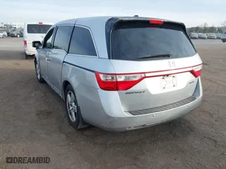 2012 Honda Odyssey Touring with VIN 5FNRL5H96CB095264, listed as a IAAI auction lot 41403450 with 246,199 mi miles. Bid and sale history available at carsss.com. Image 3.