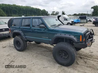 1997 Jeep Cherokee SE with VIN 1J4FJ28S2VL553709, listed as a Copart auction lot 63340974 with 154,029 mi miles and Clean Title. Bid and sale history available at carsss.com. Image 4.