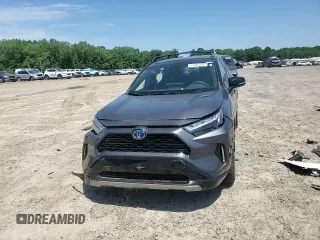 2023 Toyota RAV4 Hybrid XSE with VIN 2T3E6RFV9PW039963, listed as a Copart auction lot 57594335 with 27,486 mi miles and Salvage title. Bid and sale history available at DreamBid. Image 14.