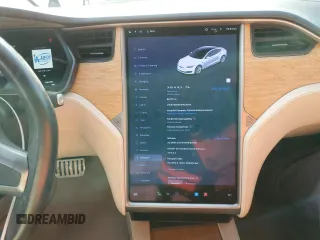 2019 Tesla Model S 100D with VIN 5YJSA1E44KF335113, listed as a Copart auction lot 82936844 with 89,770 mi miles and Salvage title. Bid and sale history available at DreamBid. Image 9.