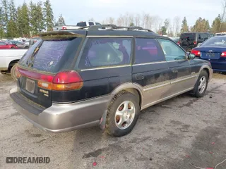 1999 Subaru Legacy Wagon Outback with VIN 4S3BG6856X7603852, listed as a IAAI auction lot 41299373 with 168,991 mi miles. Bid and sale history available at carsss.com. Image 4.