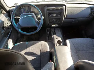 2000 Jeep Cherokee with VIN 1J4FF48S0YL198802, listed as a Copart auction lot 59996915 with 249,756 mi miles and Salvage title. Bid and sale history available at DreamBid. Image 8.