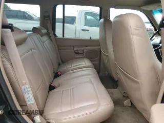 1999 Mercury Mountaineer z VIN 4M2DU52P9XUJ10152, wystawiony jako Copart lot #76283584 z przebiegiem 32 199 mil mil oraz Tytuł czysty. Historia ofert i sprzedaży dostępna na DreamBid. Obrazek 10.
