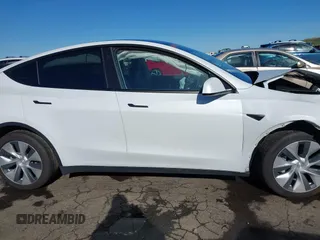 2022 Tesla Model Y Long Range with VIN 7SAYGDEE1NF402745, listed as a IAAI auction lot 41493850 with 11,222 mi miles and . Bid and sale history available at DreamBid. Image 13.