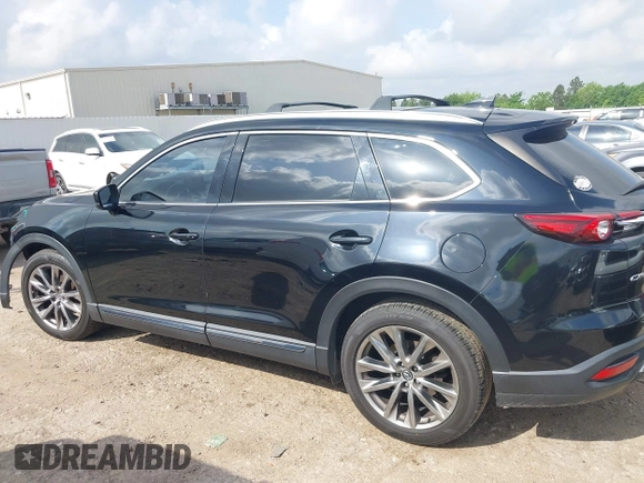 2017 Mazda CX-9 Grand Touring with VIN JM3TCADY5H0129798, listed as a IAAI auction lot 42079754 with 128,403 mi miles and . Bid and sale history available at DreamBid. Image 15.