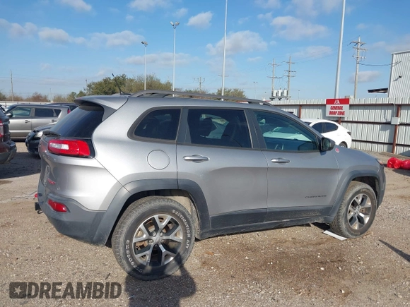 2015 Jeep Cherokee Trailhawk with VIN 1C4PJMBS3FW662307, listed as a IAAI auction lot 41778932 with 64,569 mi miles. Bid and sale history available at carsss.com. Image 13.