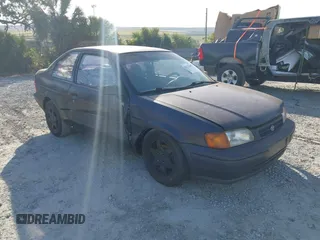 1996 Toyota Tercel DX z VIN JT2AC52L1T0117437, wystawiony jako IAAI lot #42077726 z przebiegiem 240 426 mil mil oraz . Historia ofert i sprzedaży dostępna na DreamBid. Obrazek 1.