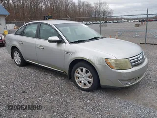 2009 Ford Taurus SE with VIN 1FAHP23W29G105160, listed as a IAAI auction lot 41682897 with 68,560 mi miles. Bid and sale history available at carsss.com. Image 1.