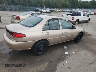 1999 Ford Escort SE with VIN 1FAFP13P7XW274653, listed as a Copart auction lot 71997184 with 67,876 mi miles and Salvage Title. Bid and sale history available at carsss.com. Image 3.
