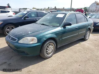 1999 Honda Civic VP with VIN 2HGEJ6619XH509582, listed as a IAAI auction lot 41774443 with 231,357 mi miles. Bid and sale history available at carsss.com. Image 2.