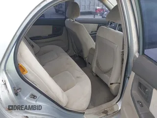 2005 Kia Spectra LX with VIN KNAFE121755142490, listed as a IAAI auction lot 42085928 with 170,406 mi miles. Bid and sale history available at carsss.com. Image 8.