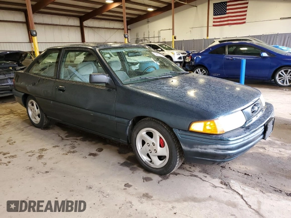 1996 Ford Escort z VIN 1FASP11J0TW123967, wystawiony jako Copart lot #52859835 z przebiegiem 164 693 mil mil oraz Szkoda całkowita • Salvage title. Historia ofert i sprzedaży dostępna na DreamBid. Obrazek 4.