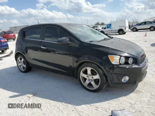2012 Chevrolet Sonic LTZ z VIN 1G1JE6SH9C4130554, wystawiony jako Copart lot #45020925 z przebiegiem 152 038 mil mil oraz Czysty tytuł • Clean title. Historia ofert i sprzedaży dostępna na DreamBid. Obrazek 4.