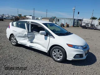 2014 Honda Insight EX with VIN JHMZE2H71ES002369, listed as a IAAI auction lot 42455582 with 114,331 mi miles and . Bid and sale history available at DreamBid. Image 1.
