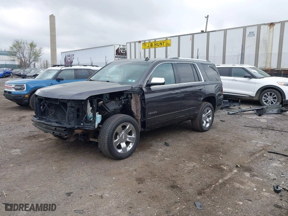 2015 Chevrolet Tahoe LTZ with VIN 1GNSKCKC2FR107428, listed as a IAAI auction lot 41911940 with 148,668 mi miles. Bid and sale history available at carsss.com. Image 18.