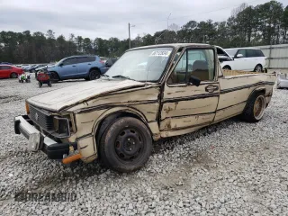1982 Volkswagen Rabbit z VIN 1V1KG0175CV012235, wystawiony jako Copart lot #86112834 z przebiegiem 186 959 mil mil oraz Szkody całkowita. Historia ofert i sprzedaży dostępna na DreamBid. Obrazek 1.
