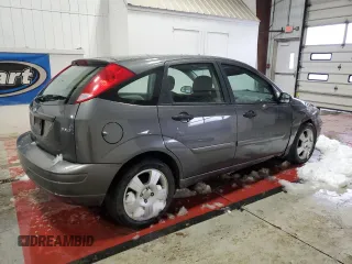 2005 Ford Focus S z VIN 3FAFP37N25R133770, wystawiony jako Copart lot #54927585 z przebiegiem 179 959 mil mil oraz Nie do naprawy. Historia ofert i sprzedaży dostępna na DreamBid. Obrazek 3.