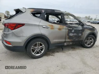 2017 Hyundai Santa Fe 2.4L z VIN 5NMZUDLB0HH042101, wystawiony jako Copart lot #55058145 z przebiegiem Nie podano mil oraz Szkoda całkowita • Salvage title. Historia ofert i sprzedaży dostępna na DreamBid. Obrazek 3.