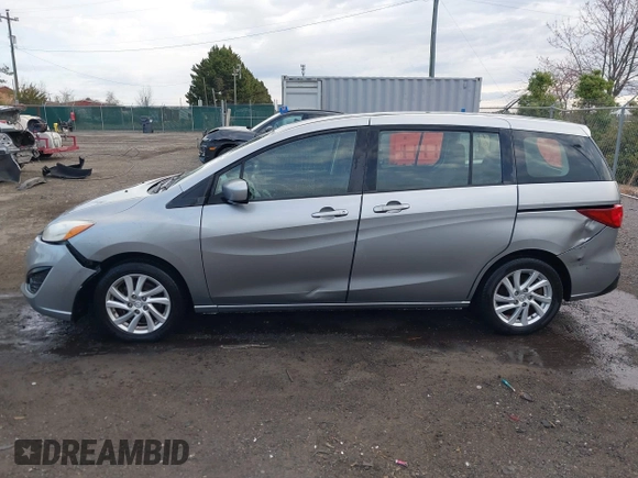 2012 Mazda 5 Sport with VIN JM1CW2BLXC0107933, listed as a IAAI auction lot 41813231 with 164,395 mi miles and . Bid and sale history available at DreamBid. Image 15.