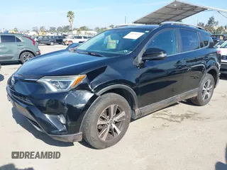 2016 Toyota RAV4 XLE with VIN 2T3RFREV6GW459313, listed as a IAAI auction lot 42074337 with 149,914 mi miles and . Bid and sale history available at DreamBid. Image 2.