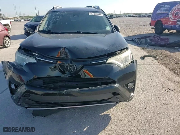2018 Toyota RAV4 XLE with VIN 2T3WFREV2JW472232, listed as a Copart auction lot 52464025 with 131,421 mi miles and Salvage Title. Bid and sale history available at carsss.com. Image 12.