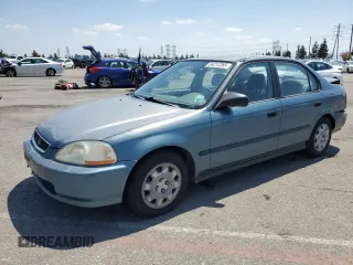 1998 Honda Civic DX with VIN JHMEJ6624WS000450, listed as a Copart auction lot 54217265 with 299,994 mi miles and Salvage Title. Bid and sale history available at carsss.com. Image 1.