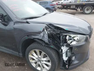 2014 Mazda CX-5 Grand Touring with VIN JM3KE4DY4E0343863, listed as a IAAI auction lot 41770402 with 117,615 mi miles. Bid and sale history available at carsss.com. Image 6.