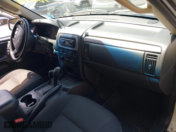 2004 Jeep Grand Cherokee Laredo with VIN 1J4GW48S54C314056, listed as a IAAI auction lot 42096065 with 164,113 mi miles. Bid and sale history available at carsss.com. Image 5.