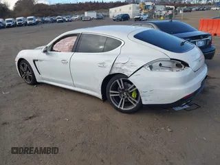 2014 Porsche Panamera S E-Hybrid with VIN WP0AD2A76EL044722, listed as a IAAI auction lot 40716615 with 52,474 mi miles and . Bid and sale history available at DreamBid. Image 3.