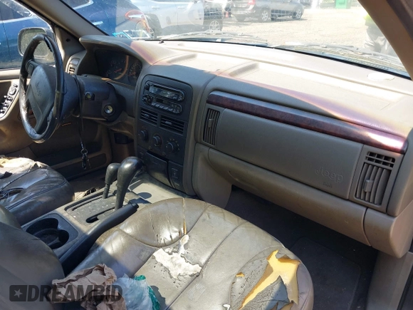 2000 Jeep Grand Cherokee Laredo with VIN 1J4GW48S8YC380039, listed as a IAAI auction lot 42510307 with 215,776 mi miles and . Bid and sale history available at DreamBid. Image 5.