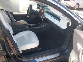 2018 Tesla Model 3 Long Range Battery with VIN 5YJ3E1EBXJF055203, listed as a IAAI auction lot 42019770 with 57,379 mi miles and . Bid and sale history available at DreamBid. Image 5.