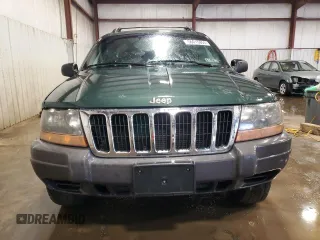 2000 Jeep Grand Cherokee Laredo with VIN 1J4GW48S2YC256123, listed as a Copart auction lot 56015855 with 147,549 mi miles and Salvage title. Bid and sale history available at DreamBid. Image 5.