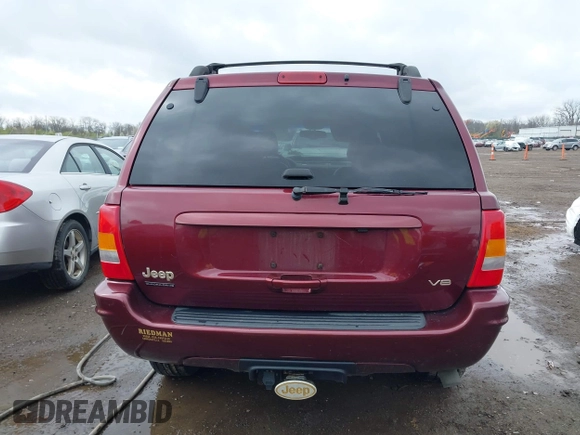 1999 Jeep Grand Cherokee Limited with VIN 1J4GW68N5XC642670, listed as a IAAI auction lot 41990199 with 154,492 mi miles. Bid and sale history available at carsss.com. Image 17.