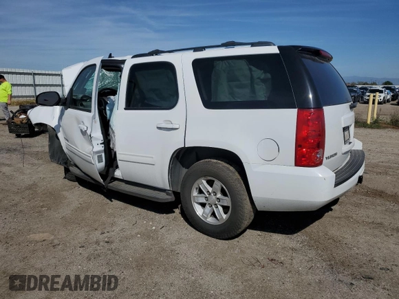 2013 GMC Yukon SLE with VIN 1GKS1AE03DR191410, listed as a Copart auction lot 48658234 with 121,572 mi miles and Salvage Title. Bid and sale history available at carsss.com. Image 2.