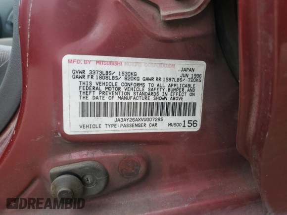 1997 Mitsubishi Mirage DE z VIN JA3AY26AXVU007285, wystawiony jako Copart lot #71958454 z przebiegiem 156 415 mil mil oraz Szkoda całkowita • Salvage title. Historia ofert i sprzedaży dostępna na DreamBid. Obrazek 12.
