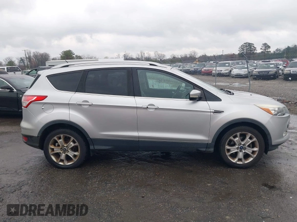 2016 Ford Escape Titanium with VIN 1FMCU0JX7GUB25573, listed as a IAAI auction lot 41871980 with 157,525 mi miles. Bid and sale history available at carsss.com. Image 13.