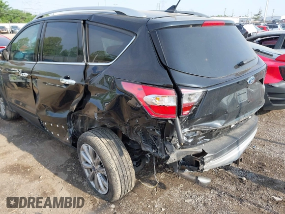 2018 Ford Escape Titanium with VIN 1FMCU9J95JUB30803, listed as a IAAI auction lot 42286536 with 63,309 mi miles and . Bid and sale history available at DreamBid. Image 6.