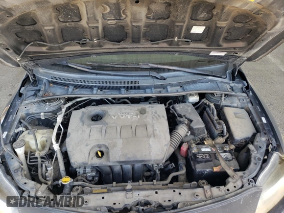 2010 Toyota Corolla z VIN 2T1BU4EE6AC455239, wystawiony jako Copart lot #60570335 z przebiegiem 256 499 mil mil oraz Szkoda całkowita • Salvage title. Historia ofert i sprzedaży dostępna na DreamBid. Obrazek 11.
