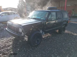 1996 Jeep Cherokee Sport with VIN 1J4FT68S6TL214000, listed as a IAAI auction lot 41481810 with 148,098 mi miles. Bid and sale history available at carsss.com. Image 2.