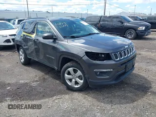 2020 Jeep Compass Latitude with VIN 3C4NJDBB9LT143240, listed as a IAAI auction lot 42236509 with 77,296 mi miles and . Bid and sale history available at DreamBid. Image 1.