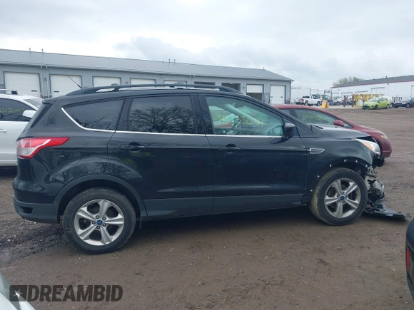 2013 Ford Escape SE with VIN 1FMCU0GX6DUC98598, listed as a IAAI auction lot 42133641 with 174,111 mi miles and . Bid and sale history available at DreamBid. Image 13.